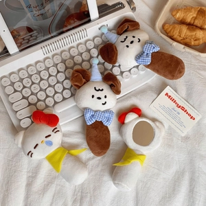 Close-up of cute plush handheld mirrors featuring cartoon cat and puppy character designs
