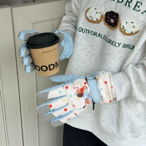 Detail of winter ski gloves with cute cartoon prints and adjustable velcro wrist straps