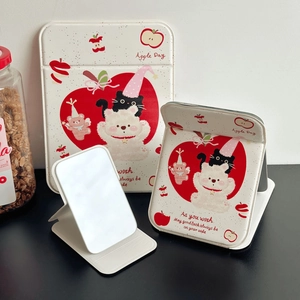 Foldable vanity mirror featuring cute bear and apple patterns on white faux leather