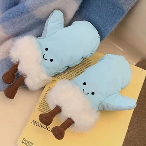Detail of light blue windproof ski mittens featuring plush lining and cartoon foot design