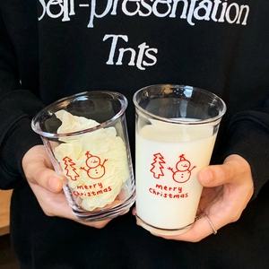 Christmas snowman glass cups for coffee and milk with festive tree prints and holiday text