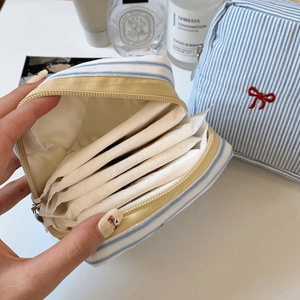 Blue striped cotton mini pouch with red bow embroidery and yellow zipper for small items