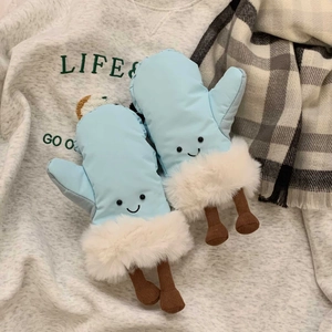 Close-up of light blue cartoon ski mittens with plush white trim and knitted legs detail