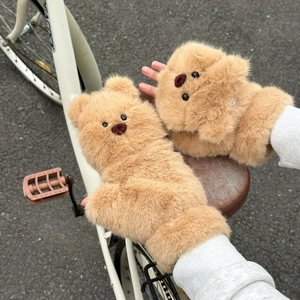 Close-up of cute brown teddy bear plush convertible mittens with thick faux fur texture