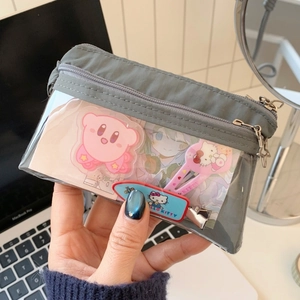 Detail view of the gray cat-themed wallet with clear display window and star zippers
