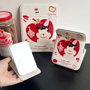 Detail of portable foldable makeup mirror with cute bear and apple illustration