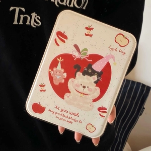 Close-up of cute bear and apple pattern on portable metal makeup mirror case