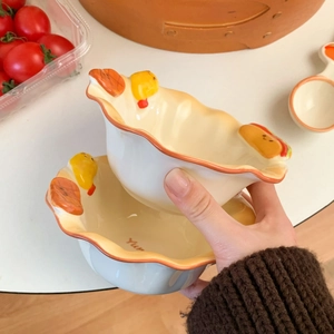 Detail of ceramic breakfast bowl featuring a 3D yellow chick and wavy irregular rim