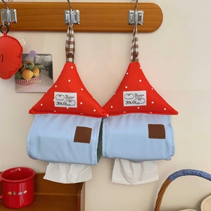 Close-up of fabric mushroom tissue box covers with red polka dots and wooden buttons