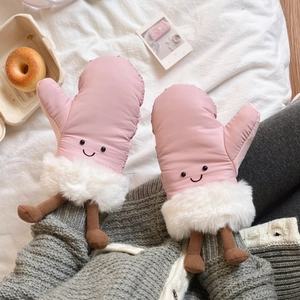 Pink cartoon ski gloves with plush fur cuffs and cute knitted feet details in detail view