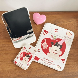 Detail of white foldable makeup mirror with cute bear and apple patterned PU leather cases