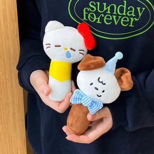 Close-up of cute plush Hello Kitty and Pompompurin hand-held mirrors with soft texture