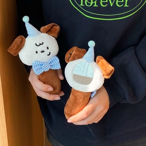 Close-up of cute plush puppy hand mirror with soft embroidery detail and mini round glass