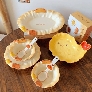 Detail of cartoon food theme ceramic tableware with embossed hotdog and shrimp motifs