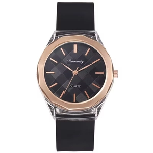 Minimalist quartz watch with black silicone strap and rose gold bezel on white background