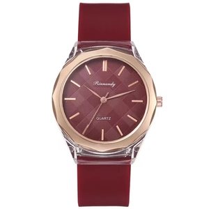 Minimalist burgundy silicone watch with a golden octagonal bezel and quartz movement