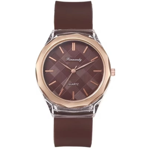 Detail of rose gold polygonal bezel and brown silicone strap on quartz watch