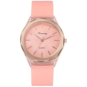 Pink silicone watch with rose gold octagonal bezel and diamond pattern dial on white backdrop