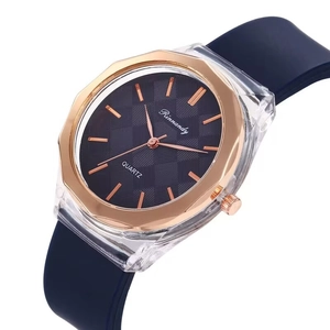 Detail of blue silicone strap and rose gold octagonal bezel on minimalist quartz watch