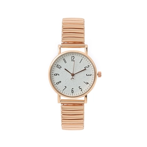 Women's rose gold quartz watch with flexible metal stretch band and white dial