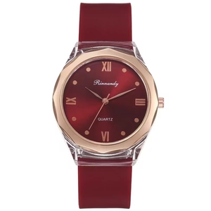 Minimalist red silicone strap watch with rose gold octagonal case and Roman numerals