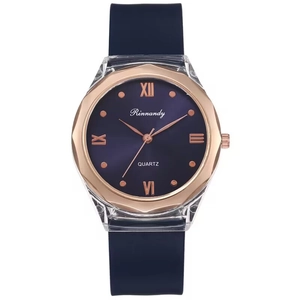 Deep blue silicone quartz watch with rose gold Roman numerals on white background