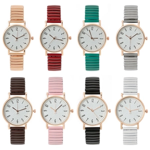 Eight colors of minimalist round quartz watches with elastic wavy bands on white background