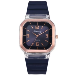 Macro shot of navy blue dial with rose gold octagonal bezel and quartz movement detail