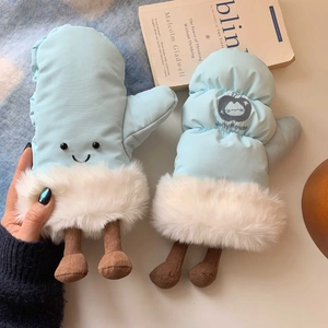 Detail of light blue winter mittens with cute smiley face and white faux fur trim