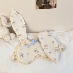 Detailed view of cream cotton sleep mask featuring lace trim, rabbit ears, and blue bow