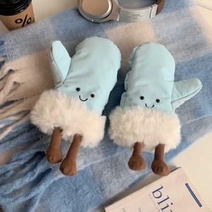 Close-up of light blue creative ski mittens with smiley face embroidery and white faux fur trim