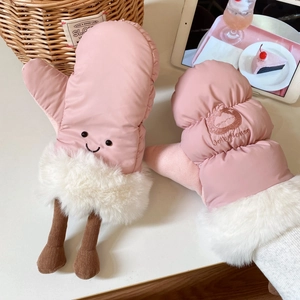 Close-up of pink quilted skiing mittens with cute face embroidery and faux fur cuff detail
