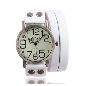 Detail of vintage quartz watch with white triple wrap leather strap and bronze rivets