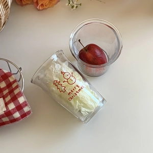 Christmas snowman glass cup featuring Merry Christmas text and festive tree illustration