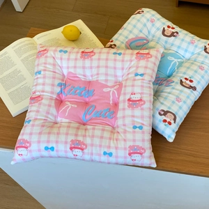 Detail view of thickened plaid seat cushions with cute cartoon cat and strawberry embroidery