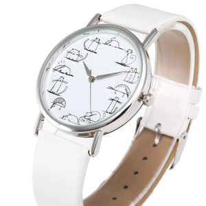 Detail of creative quartz watch dial featuring twelve unique cartoon cat illustrations