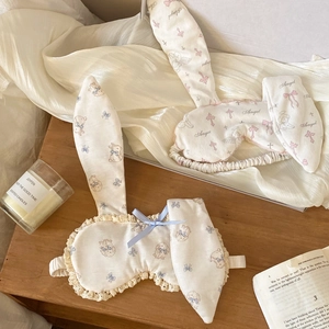 Detail of cute rabbit-ear eye masks with lace trim and soft elastic bands for sleeping