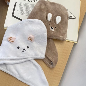 Detailed view of plush coral fleece hair drying towels with cute animal embroidery