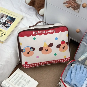 Detail view of cartoon puppy travel tote bag showing red zipper and brown handle strap