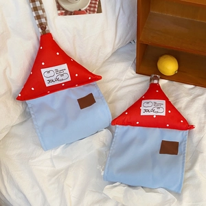 Polka dot house tissue box detail featuring checkered hanging strap and canvas texture