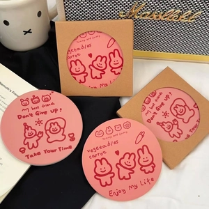 Detail of pink cartoon rabbit ceramic coaster with Enjoy My Life text in gift packaging