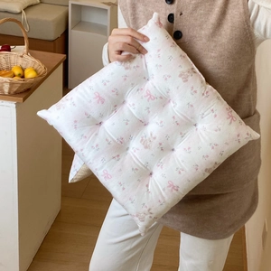Detail of floral chair cushion with nine-point quilting and soft cotton filling