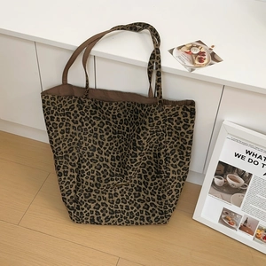 Large leopard print canvas tote bag for women showing spacious minimalist shoulder design