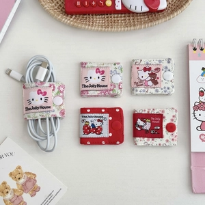 Flat lay view of cute floral fabric cable organizers with button snap closures