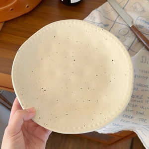 Japanese matte cream ceramic plate with black ink splashes and pearl relief edges