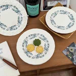 French vintage floral ceramic dinner plates with embossed edges and blue floral patterns