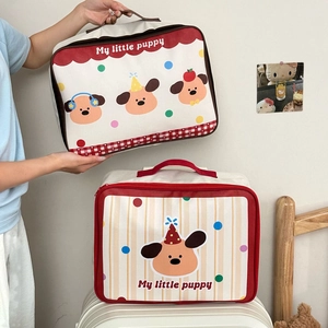 Detail of cartoon puppy travel storage bags with luggage strap and top handle grips