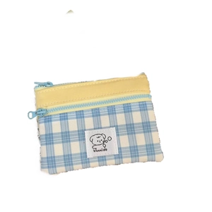Blue and white checkered double-layer storage pouch with yellow trim and puppy patch