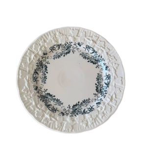 French vintage ceramic plate with black floral pattern and embossed vine border on white background