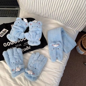 Detail of light blue fuzzy plush scarf and glove set with cute embroidered cat ears